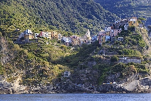 Colourful houses and cliffs atop rocky promontory, Corniglia, Cinque Terre, UNESCO Colourful houses and cliffs atop rocky promontory, Corniglia, Cinque Terre, UNESCO