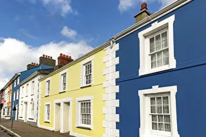 Some of the many colourful regency style houses by the harbour in this popular coastal Some of the many colourful regency style houses by the harbour in this popular coastal