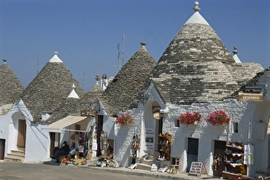 Conical roofs and whitewashed walls of Trullis in Alberobello Conical roofs and whitewashed walls of Trullis in Alberobello