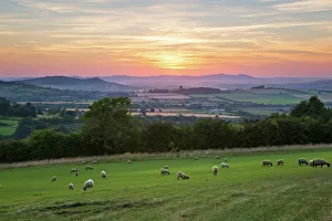 Cotswold landscape and distant Malvern Hills at sunset, Farmcote, Cotswolds, Gloucestershire Cotswold landscape and distant Malvern Hills at sunset, Farmcote, Cotswolds, Gloucestershire