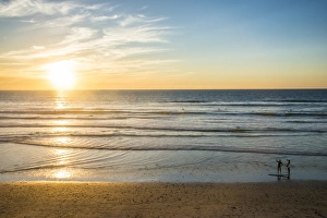 California Coastline Photography Prints: Couple in backlight walking at sunset, Del Mar, California, United States of America