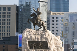 Damdin Sukhbaatar statue with skyscrapers in the background, Ulan Bator, Mongolia Damdin Sukhbaatar statue with skyscrapers in the background, Ulan Bator, Mongolia