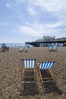 English Coastal Towns Prints: Deck chairs and pier, Brighton Beach, Brighton, Sussex, England, United Kingdom, Europe