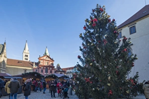 Colourful European Cityscape Prints: A decorated Christmas tree frames the St. George Church, Prague, Czech Republic, Europe