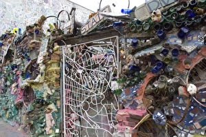 Prints of Decoration of patterns in glass, mirrors, ceramics and other fragments of objects embedded in stucco by sculptor Isaiah Zagar, South Street, Philadelphia, Pennsylvania, United States of America Images Dated 2006 January: Decorative Stucco Print with Embedded Glass and Ceramics