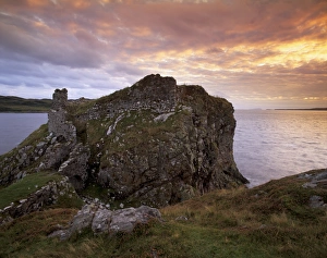 Dunscaith Castle ruins (Dun Sgathaich) at sunset Dunscaith Castle ruins (Dun Sgathaich) at sunset