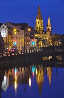 A dusk view of St. Fin Barres Cathedral, on the banks of the Lee River, in Cork A dusk view of St. Fin Barres Cathedral, on the banks of the Lee River, in Cork