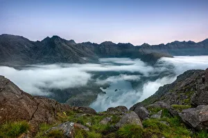 Early morning clouds drifting over the hills flowing down to Loch Coruisk below with Early morning clouds drifting over the hills flowing down to Loch Coruisk below with