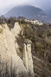 Earth pyramids (rock chimneys) with old houses of Zone, Brescia province, Lombardy, Italy Earth pyramids (rock chimneys) with old houses of Zone, Brescia province, Lombardy, Italy