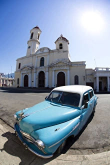 Fisheye image of vintage American car and church, Parc Jose Marti, Cienfuegos, UNESCO World Heritage Site, Cuba Fisheye image of vintage American car and church, Parc Jose Marti, Cienfuegos, UNESCO World Heritage Site, Cuba
