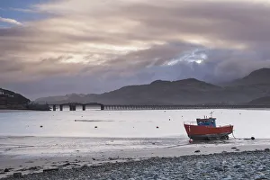 Fishing boat and Barmouth Bridge in Barmouth Harbour with Cader (Cadair) Mountains behind Fishing boat and Barmouth Bridge in Barmouth Harbour with Cader (Cadair) Mountains behind