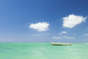 Fishing boat on the turquoise waters, Le Morne, Black River, Mauritius, Indian Ocean Fishing boat on the turquoise waters, Le Morne, Black River, Mauritius, Indian Ocean