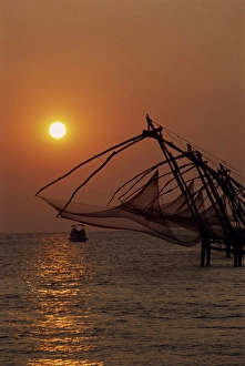Fishing Boats At Sunset Prints: Fishing nets at sunset