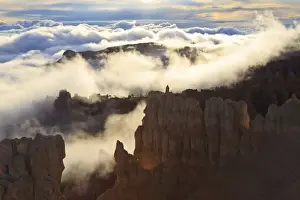 North American Scenery Prints: Fog and clouds of a partial temperature inversion surround the red rocks of Bryce Canyon