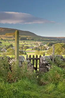 A footpath signpost and gate leading to Hawes village in Wensleydale, The Yorkshire Dales A footpath signpost and gate leading to Hawes village in Wensleydale, The Yorkshire Dales