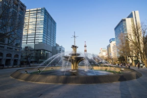 Fountain in the Odori Park, downtown Sapporo at sunset, Hokkaido, Japan, Asia Fountain in the Odori Park, downtown Sapporo at sunset, Hokkaido, Japan, Asia