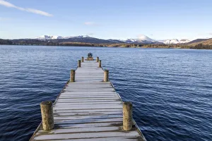 Frost covered jetty at the north end of Windermere near Ambleside, with rugged snow Frost covered jetty at the north end of Windermere near Ambleside, with rugged snow
