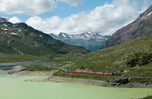 The Glacier Express train near St. Moritz, Canton Graubunden, Swiss Alps The Glacier Express train near St. Moritz, Canton Graubunden, Swiss Alps