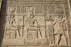 Gods Hathor on left and Haroeris in centre with Pharaoh on the right, Wall Reliefs Gods Hathor on left and Haroeris in centre with Pharaoh on the right, Wall Reliefs