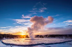 Great Fountain Geyser at sunset with reflection and sunburst, Yellowstone National Park Great Fountain Geyser at sunset with reflection and sunburst, Yellowstone National Park