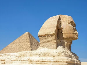 Historic Cairo Collection: The Great Sphinx of Giza near the Great Pyramid of Giza, the oldest of the Seven Wonders of