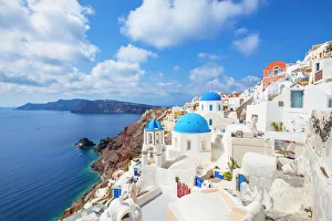 Greek church with three blue domes in the village of Oia, Santorini (Thira), Cyclades Islands, Greek Islands, Greece Greek church with three blue domes in the village of Oia, Santorini (Thira), Cyclades Islands, Greek Islands, Greece