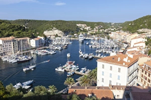 The green vegetation frames the medieval town and harbour, Bonifacio, Corsica, France The green vegetation frames the medieval town and harbour, Bonifacio, Corsica, France