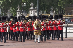 Guards Military Band marching past Buckingham Palace en route to the Trooping of the Colour Guards Military Band marching past Buckingham Palace en route to the Trooping of the Colour