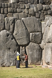 Guide talking to tourists at the Inca fortification of Sacsayhuaman, near Cuzco Guide talking to tourists at the Inca fortification of Sacsayhuaman, near Cuzco
