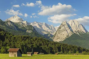Hay barns at Hammersbach Footpath against Wetterstein Mountain Range Hay barns at Hammersbach Footpath against Wetterstein Mountain Range