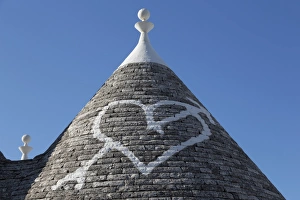 Heart painted on roof of traditional trullo in Alberobello, UNESCO World Heritage Site, Puglia, Italy, Europe Heart painted on roof of traditional trullo in Alberobello, UNESCO World Heritage Site, Puglia, Italy, Europe