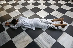 Prints of Hindu devotee prostrating at Krishna-Balaram temple, Vrindavan, Uttar Pradesh, India, Asia Images Dated 2016 October: Hindu devotee prostrating at Krishna-Balaram temple Print