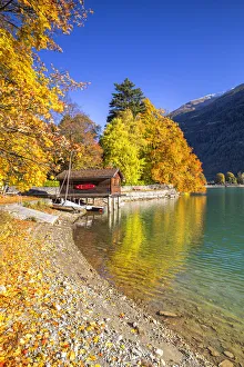 House on stilts on the shore of Lake Poschiavo in autumn, Valposchiavo, Canton of Graubunden, Switzerland, Europe House on stilts on the shore of Lake Poschiavo in autumn, Valposchiavo, Canton of Graubunden, Switzerland, Europe