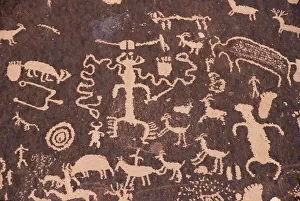 Indian petroglyphs drawn on red standstone by scratching Indian petroglyphs drawn on red standstone by scratching