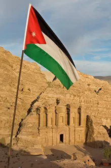 The Jordanian flag in front of Al Deir (the Monastery) at sunset, Petra The Jordanian flag in front of Al Deir (the Monastery) at sunset, Petra