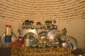 Kitchen ware inside beehive house built of brick and mud Kitchen ware inside beehive house built of brick and mud
