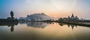 Kyauk Kalap Buddhist Temple in the middle of a lake at sunrise, Hpa An, Kayin State Kyauk Kalap Buddhist Temple in the middle of a lake at sunrise, Hpa An, Kayin State