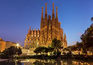 Prints of La Sagrada Familia church lit up at night designed by Antoni Gaudi, UNESCO World Heritage Site, reflected in pool, Barcelona, Catalonia (Catalunya), Spain, Europe Spain Prints: La Sagrada Familia at Night Print