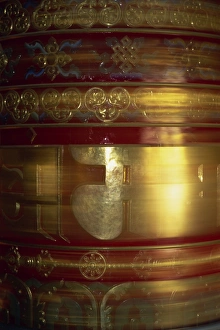 Large gold and red spinning Buddhist prayer wheels Large gold and red spinning Buddhist prayer wheels