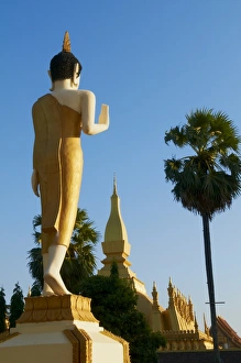 Large standing Buddha statue, Pha That Luang temple, Vientiane, Laos, Indochina Large standing Buddha statue, Pha That Luang temple, Vientiane, Laos, Indochina