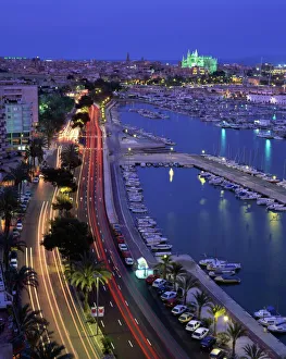 Lights at dusk, with boats in the marina and Palma cathedral across the bay Lights at dusk, with boats in the marina and Palma cathedral across the bay