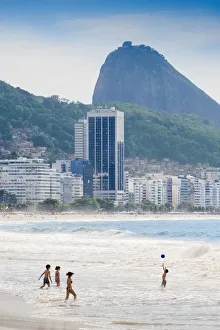 Locals playing ball in the surf, Copacabana Beach, Rio de Janeiro, Brazil, South America Locals playing ball in the surf, Copacabana Beach, Rio de Janeiro, Brazil, South America