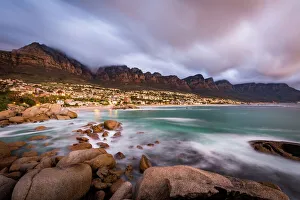 Long exposure at sunset at Camps Bay with cloud over Table Mountain and the Twelve Apostles Long exposure at sunset at Camps Bay with cloud over Table Mountain and the Twelve Apostles