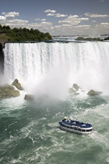 Maid of the Mist sails near the American Falls in Niagara Falls, New York State Maid of the Mist sails near the American Falls in Niagara Falls, New York State