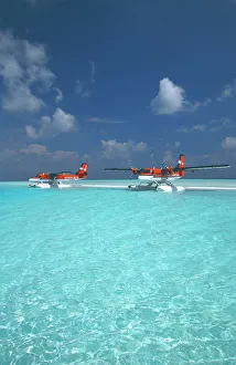 Maldivian air taxi seaplanes parked on sandbank, Maldives, Indian Ocean, Asia Maldivian air taxi seaplanes parked on sandbank, Maldives, Indian Ocean, Asia
