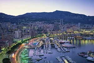The marina, waterfront and town of Monte Carlo in the evening, Monaco, Mediterranean The marina, waterfront and town of Monte Carlo in the evening, Monaco, Mediterranean