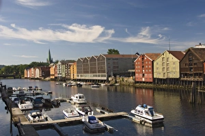 Merchants warehouses and boat moorings along the Nidelva, Trondheim, Norway Merchants warehouses and boat moorings along the Nidelva, Trondheim, Norway