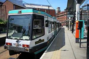 Prints of Metrolink tram at tram stop, Manchester, England, United Kingdom, Europe Manchester Prints: Metrolink Tram Print, Manchester, UK
