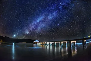 The Milky Way and Venus rise over the Hanalei Bay with the Hanalei Pier in the foreground The Milky Way and Venus rise over the Hanalei Bay with the Hanalei Pier in the foreground