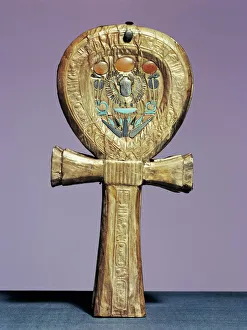 Mirror case in the form of an ankh, the sign of life, made of gilt wood inlaid with glass-paste Mirror case in the form of an ankh, the sign of life, made of gilt wood inlaid with glass-paste